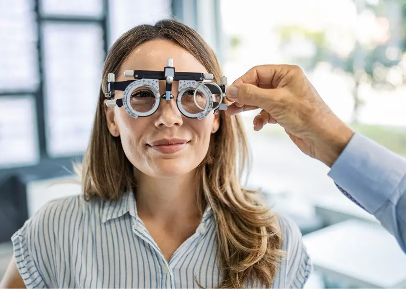 Optometrist adjusting eyeglass lenses